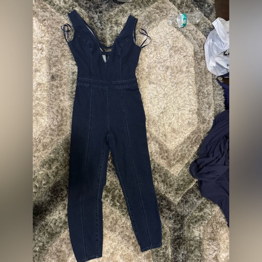 Bebe Jean jumpsuit size 4 brand new